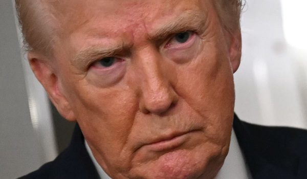 US President Donald Trump speaks to the press aboard Air Force One on January 11, 2026. Trump said Sunday his administration was working well with Venezuela's interim leader Delcy Rodriguez and that he would be open to meeting with her. (Photo by ANDREW CABALLERO-REYNOLDS / AFP)
