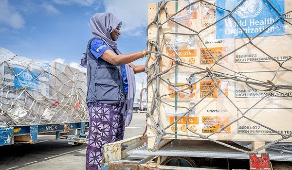 FILE PHOTO: Fatima Tafida, the Regional Supply Chain Lead for Emergencies at the World Health Organization's (WHO) Regional Office for Africa pastes stickers on shipment pallets as the WHO mobilises 4.7 tonnes of essential medical supplies and emergency kits to support the affected regions in response to the Ebola outbreak in the Democratic Republic of Congo from the Jomo Kenyatta International Airport (JKIA) in Nairobi, Kenya May 18, 2026.  World Health Organization/Handout via REUTERS THIS IMAGE HAS BEEN SUPPLIED BY A THIRD PARTY/File Photo