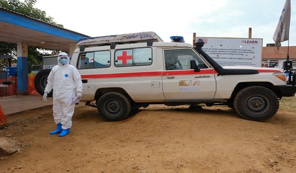 FILE PHOTO: A doctor wearing personal protective equipment (PPE) stands near an ambulance at the Ebola Virus Disease Treatment Center at the Bunia General Reference Hospital, one month after cases were confirmed in Bunia, eastern Democratic Republic of Congo, June 15, 2026. REUTERS/Gradel Muyisa Mumbere/File Photo