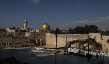 A view of the deserted Jewish Western Wall and the al-Aqsa Mosque compound and the Dome of the Rock (background), on the eve of the last Friday noon prayers of the holy Muslim fasting month of Ramadan, as the Israeli-US war against Iran continues, in the old city of Jerusalem on March 12, 2026. On February 28, Israel and the United States launched strikes on Iran, killing its supreme leader Ayatollah and triggering a war that spread across the Middle East. (Photo by HAZEM BADER / AFP) /