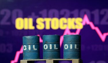 FILE PHOTO: 3D printed oil barrels, rising stock graph and words "Oil Stocks" are seen in this illustration taken March 23, 2026. REUTERS/Dado Ruvic/File Photo