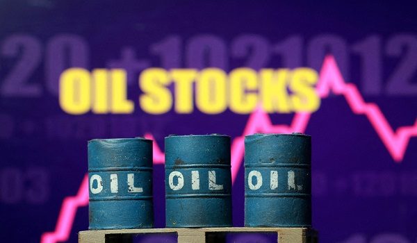 FILE PHOTO: 3D printed oil barrels, rising stock graph and words "Oil Stocks" are seen in this illustration taken March 23, 2026. REUTERS/Dado Ruvic/File Photo