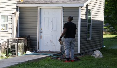 SENSITIVE MATERIAL. THIS IMAGE MAY OFFEND OR DISTURB A man uses a water hose to wash blood from a door after children, with ages ranging from 1 to 14, were killed in a mass shooting incident described as domestic violence, in Shreveport, Louisiana, U.S. April 19, 2026.  REUTERS/Kevin Bartram     TPX IMAGES OF THE DAY