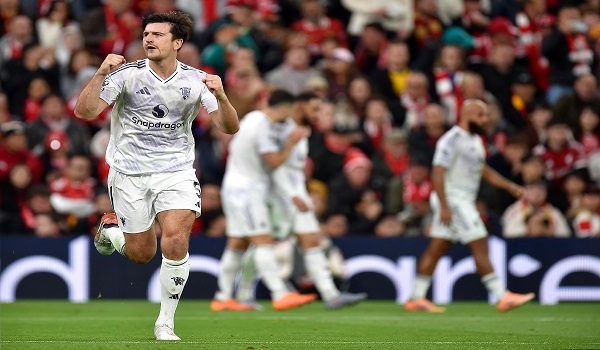 Harry Maguire meraikan jaringan ketika menentang Liverpool / AFP