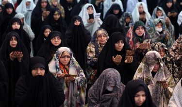 Iranian Shia women take part in Eid al-Fitr prayers, marking the end of the Muslim holy month of Ramadan, at the Grand Mosalla mosque in Tehran on March 21, 2026. The Iranian capital has come under near-daily bombardment since a joint US-Israeli attack started the war on February 28, killing top officials, including the Islamic republic's supreme leader. (Photo by AFP)