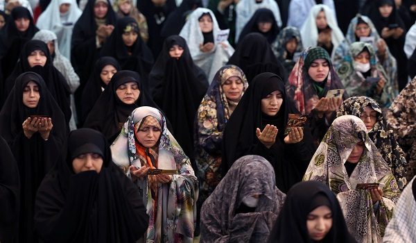 Iranian Shia women take part in Eid al-Fitr prayers, marking the end of the Muslim holy month of Ramadan, at the Grand Mosalla mosque in Tehran on March 21, 2026. The Iranian capital has come under near-daily bombardment since a joint US-Israeli attack started the war on February 28, killing top officials, including the Islamic republic's supreme leader. (Photo by AFP)