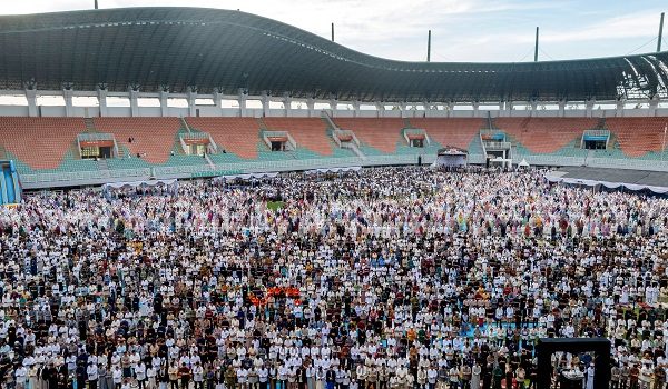 A drone view shows Muslims offering mass prayers during Eid al-Fitr, marking the end of Muslim holy fasting month of Ramadan, at Pakansari stadium in Bogor, West Java province, Indonesia, March 21, 2026. REUTERS/Yuddy Cahya Budiman