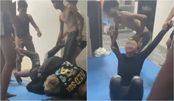 Tangkap layar menunjukkan seorang lelaki dibelasah sekumpulan lelaki, tular di media sosial