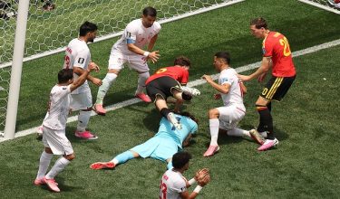 Iran's goalkeeper #01 Alireza Beiranvand makes a save past Belgium's defender #05 Maxim De Cuyper during the 2026 World Cup Group G football match between Belgium and Iran at the Los Angeles Stadium in Inglewood on June 21, 2026.  (Photo by Etienne Laurent / AFP)