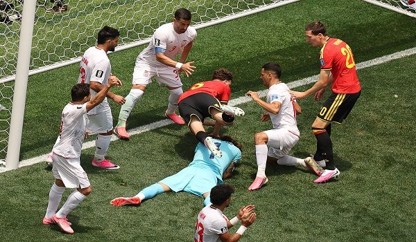 Iran's goalkeeper #01 Alireza Beiranvand makes a save past Belgium's defender #05 Maxim De Cuyper during the 2026 World Cup Group G football match between Belgium and Iran at the Los Angeles Stadium in Inglewood on June 21, 2026.  (Photo by Etienne Laurent / AFP)