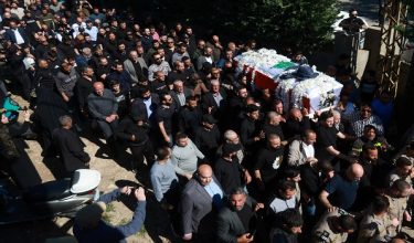 Mourners carry the coffin of journalist Amal Khalil, who was killed in an Israeli strike on Wednesday, during her funeral in Baisariyeh, Lebanon April 23, 2026. REUTERS/Aziz Taher