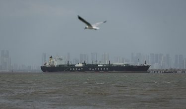 FILE PHOTO: A bird flies near the Jag Vasant vessel transferring LPG at a port after transiting the Strait of Hormuz amid supply disruptions linked to the U.S-Israeli conflict with Iran, in Mumbai, India, April 1, 2026. REUTERS/Francis Mascarenhas/File Photo