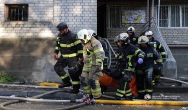 Rescuers carry a body of the person found under debris of a building which was hit during Russian drone strike, amid Russia's attack on Ukraine, in Dnipro, Ukraine, April 23, 2026. Head of Dnipropetrovsk Regional Military Administration Oleksandr Handzha via Telegram/Handout via REUTERS ATTENTION EDITORS - THIS IMAGE HAS BEEN SUPPLIED BY A THIRD PARTY. MANDATORY CREDIT. NO RESALES. NO ARCHIVES. BEST QUALITY AVAILABLE.