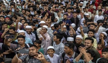 People shout slogans during a protest over alleged child rape in Dhaka on May 22, 2026. Thousands of protesters in Bangladesh clashed with police in a bid to seize a suspect accused of raping a four-year-old girl, officials said on May 22. (Photo by Abdul Goni / AFP)