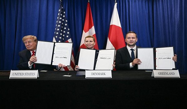 (L/R) US President Donald Trump, Denmark's Prime Minister Mette Frederiksen and Greenland's Prime Minister Jens-Frederik Nielsen sign a trilateral security deal on the sidelines of the 81st United Nations General Assembly in New York, on September 22, 2026. (Photo by Brendan SMIALOWSKI / AFP)