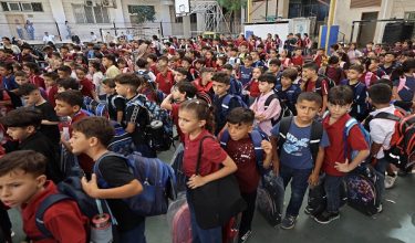 Children gather upon their arrival on the first day of the start of their school year at the Latin Patriarchate School built inside the premises of the Holy Family Church in the Zeitoun neighborhood of Gaza City on September 22, 2026. (Photo by Omar AL-QATTAA / AFP)
