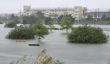 Flooding inundates a park as heavy rain falls amid weather patterns due to Typhoon Dujuan in Ichikawa city, Chiba Prefecture on September 21, 2026. Typhoon Dujuan forced the cancellation of at least 275 flights in Japan on September 21 and prompted warnings of potentially record-breaking rainfall as the storm nears Tokyo. (Photo by JIJI Press / AFP) / Japan OUT