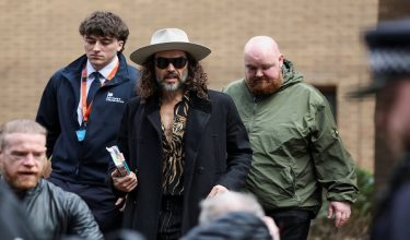 British actor and comedian Russell Brand walks outside Southwark Crown Court after pleading not guilty to additional rape and sexual assault charges in his ongoing case, in London, Britain, February 24, 2026. REUTERS/Toby Melville