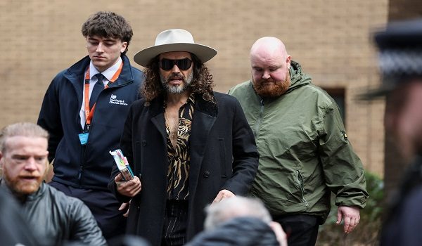 British actor and comedian Russell Brand walks outside Southwark Crown Court after pleading not guilty to additional rape and sexual assault charges in his ongoing case, in London, Britain, February 24, 2026. REUTERS/Toby Melville