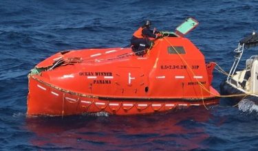 A member of the Indian Coast Guard ties a rope to a lifeboat associated with the Panama-flagged ship MV Ocean Winner that sank off the coast of Odisha last week, during a search and rescue operation in the Bay of Bengal, India, August 25, 2026. Indian Coast Guard/Handout via REUTERS THIS IMAGE HAS BEEN SUPPLIED BY A THIRD PARTY. NO RESALES. NO ARCHIVES. BEST QUALITY AVAILABLE.