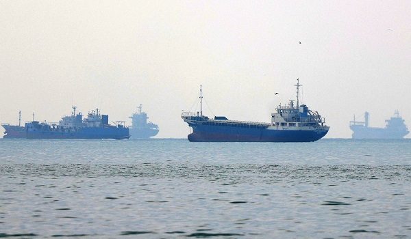 Vessels transit the Hormuz Strait off the coast of Iran's southern port city of Bandar Abbas on September 7, 2026. Iran's top negotiator threatened on September 6 of a more forceful response to any further US attacks after Tehran targeted American warships in their latest round of clashes. The exchanges of fire, which began with US raids last week, come amid a deadlock in the six-month war between the two foes. (Photo by ATTA KENARE / AFP) /