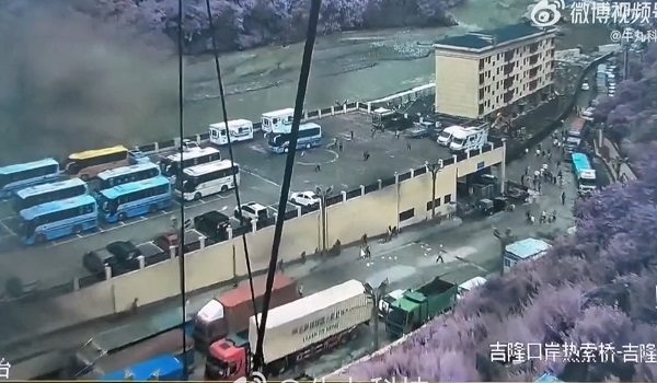 Screen recordings of surveillance camera footage posted on Chinese social media platforms, reportedly show destruction caused as flash flooding hits the Gyirong Port in the Tibet Autonomous Region on August 26, 2026, as people run to escape. The location in the footage was verified by AFP using satellite and streetview data, but original posts could not be identified. The videos have subsequently been removed from Chinese social media platforms. Chinese state broadcaster CCTV reported on Wednesday, 26 August, that "a mudslide disaster on the Nepalese side resulted in major casualties and missing people at the Gyirong Port." (Photo by UNKNOWN / AFP) / XGTY - RESTRICTED TO EDITORIAL USE - MANDATORY CREDIT «  AFP PHOTO / UNKNOWN  » - NO MARKETING NO ADVERTISING CAMPAIGNS - DISTRIBUTED AS A SERVICE TO CLIENTS - NO ARCHIVE