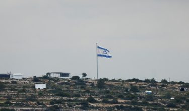 An Israeli flag flutters at a new Israeli settlement near Ramallah, in the Israeli-occupied West Bank, April 11, 2026. REUTERS/Mohammed Torokman