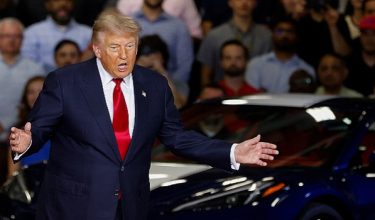 U.S. President Donald Trump gestures, as he delivers remarks on the economy, at the General Motors Proving Ground in Milford, Michigan, U.S. July 27, 2026.  REUTERS/Carlos Osorio