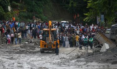 People observe the aftermath of flooding in Nuwakot, Nepal, on August 27, 2026, following an outburst of a glacial lake in Tibet. (Photo by Sanjit Pariyar/NurPhoto)NO USE FRANCE