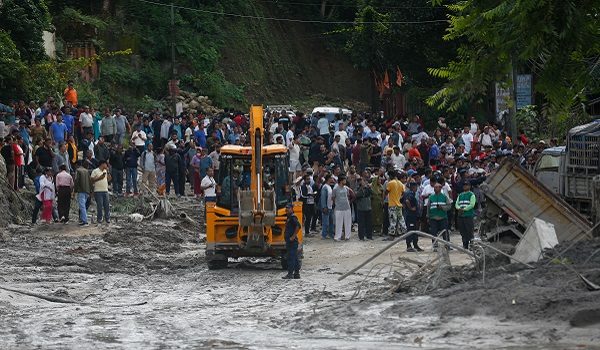 People observe the aftermath of flooding in Nuwakot, Nepal, on August 27, 2026, following an outburst of a glacial lake in Tibet. (Photo by Sanjit Pariyar/NurPhoto)NO USE FRANCE
