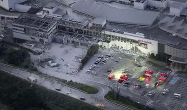 An aerial view shows rescue workers conducting a search and rescue operation at the damaged Aeon Mall shopping centre, where, according to local media, an explosion occurred after an earthquake with a preliminary magnitude of 7.1 struck Japan's southern Kumamoto prefecture, in Kashima Town, Kumamoto Prefecture, Japan, July 28, 2026. Kyodo/via REUTERS ATTENTION EDITORS - THIS IMAGE HAS BEEN SUPPLIED BY A THIRD PARTY. MANDATORY CREDIT. JAPAN OUT. NO COMMERCIAL OR EDITORIAL SALES IN JAPAN.
