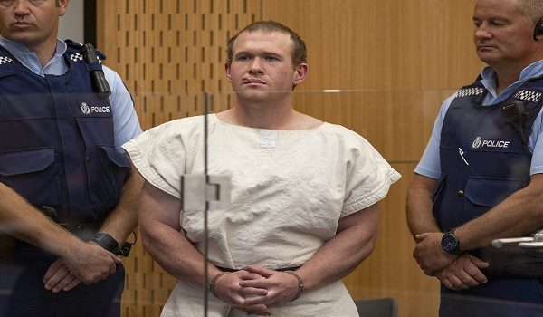 (FILES) In this picture taken on March 16, 2019, Brenton Tarrant (C), the man charged in relation to the Christchurch massacre, stands in the dock during his appearance at the Christchurch District Court. White supremacist killer Brenton Tarrant lost his appeal on April 30, 2026, seeking to overturn his conviction and sentence for shooting dead 51 people at two New Zealand mosques in 2019. (Photo by MARK MITCHELL / Wellington Court of Appeal / AFP) / RESTRICTED TO EDITORIAL USE - MANDATORY CREDIT "AFP PHOTO / WELLINGTON COURT OF APPEAL" - HANDOUT - NO MARKETING NO ADVERTISING CAMPAIGNS - DISTRIBUTED AS A SERVICE TO CLIENTS