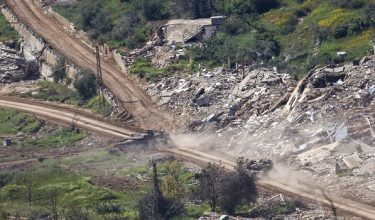 This photograph taken from the northern Israel shows an Israeli tanks driving along the road between destroyed houses in southern Lebanon near the border with Israel, on April 29, 2026. Lebanon's army said on April 29 that one of its soldiers was among two people killed in an Israeli strike in the country's south, the latest deadly raid despite a ceasefire in the Israel-Hezbollah war. (Photo by Jalaa MAREY / AFP)