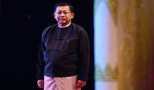 Military Chief Min Aung Hlaing looks on after delivering a speech during a memorial event at the Myanmar International Convention Centre (MICC) in Naypyidaw on March 28, 2026, to mark the first anniversary since a 7.7-magnitude tremor struck, killing more than 3,800 people in Myanmar -- and around 90 more in neighbouring Thailand. (Photo by ANTHONY WALLACE / AFP)