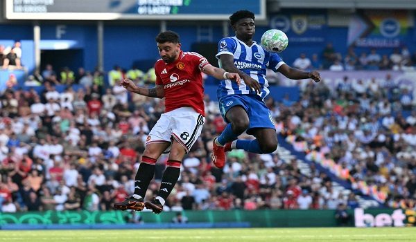 Manchester United's Portuguese midfielder #08 Bruno Fernandes (L) vies with Brighton's Cameroonian midfielder #17 Carlos Baleba during the English Premier League football match between Brighton and Hove Albion and Manchester United at the American Express Community Stadium in Brighton, southern England on May 24, 2026. (Photo by Glyn KIRK / AFP) / RESTRICTED TO EDITORIAL USE. No use with unauthorized audio, video, data, fixture lists, club/league logos or 'live' services. Online in-match use limited to 120 images. An additional 40 images may be used in extra time. No video emulation. Social media in-match use limited to 120 images. An additional 40 images may be used in extra time. No use in betting publications, games or single club/league/player publications. /