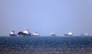 In this picture obtained from Iran's ISNA news agency on May 4, 2026, vessels are pictured anchored in the Strait of Hormuz off Bandar Abbas in southern Iran. Iran's Revolutionary Guards on May 4 denied that any commercial ships had crossed the Strait of Hormuz, after the US military earlier said two US-flagged merchant vessels had transited through the vital waterway. (Photo by Amirhossein KHORGOOEI / ISNA / AFP) /