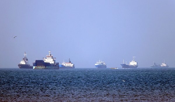 In this picture obtained from Iran's ISNA news agency on May 4, 2026, vessels are pictured anchored in the Strait of Hormuz off Bandar Abbas in southern Iran. Iran's Revolutionary Guards on May 4 denied that any commercial ships had crossed the Strait of Hormuz, after the US military earlier said two US-flagged merchant vessels had transited through the vital waterway. (Photo by Amirhossein KHORGOOEI / ISNA / AFP) /