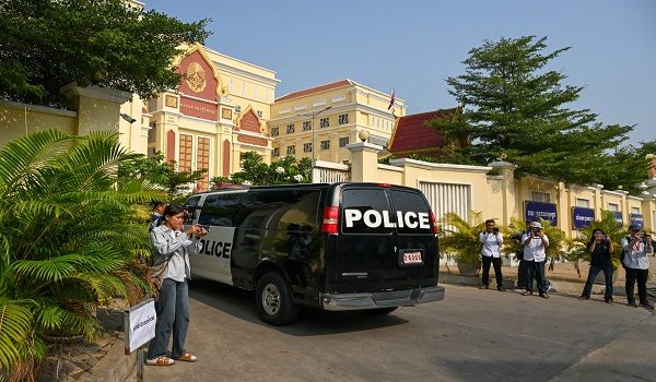 A police car transports Kem Sokha, former opposition leader of the Cambodia National Rescue Party (CNRP), into the Appeal Court for a verdict against his treason conviction, in Phnom Penh on April 30, 2026. Kem Sokha was sentenced in 2023 to 27 years in prison for treason but was ordered to serve the time under house arrest in the capital Phnom Penh. (Photo by TANG CHHIN SOTHY / AFP)