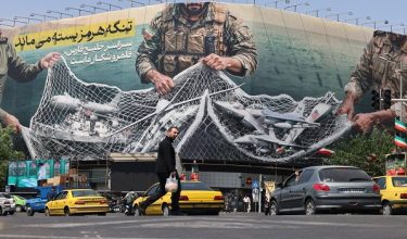 Vehicles drive past a giant billboard reading 'The Strait of Hormuz remains closed' at the Revolution Square in Tehran on April 28, 2026, The White House said on April 27 it was examining Iran's latest proposal to unblock the Strait of Hormuz, two months after a US and Israeli offensive sent shockwaves through the global economy. (Photo by ATTA KENARE / AFP) / Attention editors: AFP covers the war in the Middle East through its extensive regional network, including bureaus in Tehran, Jerusalem and several neighboring countries.Since the start of the conflict, journalists have been working under increasingly restrictive conditions. Authorities in several countries have limited reporters movements, photo and live video coverage from sensitive locations. Some governments and armed groups have banned images of missile or drone strikes and other security-related sites. /