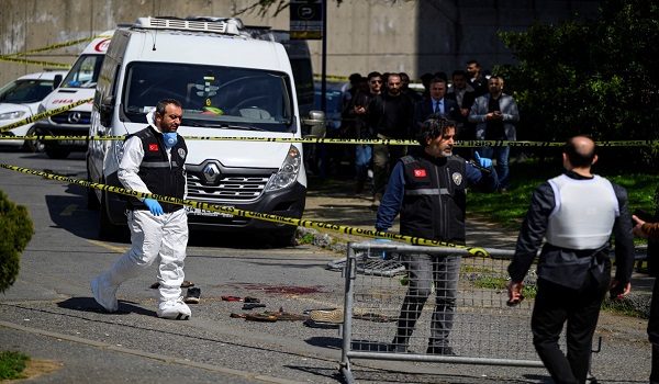 Police officials gather outside The Israeli Consulate in Istanbul on April 7, 2026, following a shootout between gunmen and police. One gunman was killed and two others were wounded in a shootout with police outside the Israeli consulate in Istanbul, the local governor said, adding two officers were lightly wounded (Photo by Yasin AKGUL / AFP)