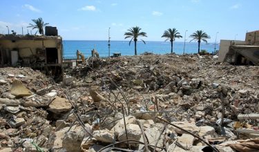 This picture shows the rubble of buildings destroyed in Israeli strikes in the southern Lebanese coastal city of Tyre on April 21, 2026. Israeli defence minister said on April 21 that his country's campaign in Lebanon relied on both military and diplomatic pressure to disarm Iran-allied Hezbollah. Though a truce between Israel and Lebanon took effect on April 17, Israeli troops are still present and actively fighting Hezbollah militants in Lebanon's south. (Photo by Mahmoud ZAYYAT / AFP)