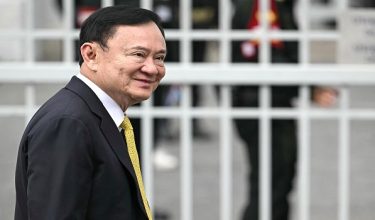 (FILES) Thailand's former Prime Minister Thaksin Shinawatra arrives at the Supreme Court in Bangkok on September 9, 2025, ahead of a ruling on whether he properly served a prison term in 2023. Thailand's jailed former prime minister Thaksin Shinawatra will be released early from prison next month, the corrections department said on April 29, 2026. (Photo by Lillian SUWANRUMPHA / AFP)