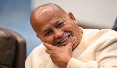 Philippine Senator Ronald Dela Rosa reacts as he talks to the media before the start of a plenary session at the Senate of the Philippines in Pasay, Metro Manila on May 12, 2026. (Photo by Jam STA ROSA / AFP)