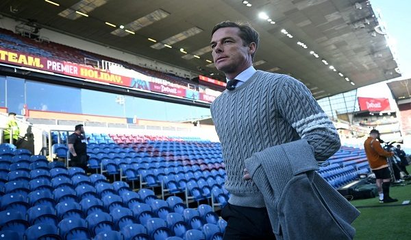 (FILES) Burnley's English manager Scott Parker arrives before the English Premier League football match between Burnley and Manchester City at Turf Moor in Burnley, north-west England on April 22, 2026. Scott Parker has left his position as head coach of Burnley following the club's relegation from the Premier League, it was announced on April 30, 2026. (Photo by Paul ELLIS / AFP) / RESTRICTED TO EDITORIAL USE. No use with unauthorized audio, video, data, fixture lists, club/league logos or 'live' services. Online in-match use limited to 120 images. An additional 40 images may be used in extra time. No video emulation. Social media in-match use limited to 120 images. An additional 40 images may be used in extra time. No use in betting publications, games or single club/league/player publications. /